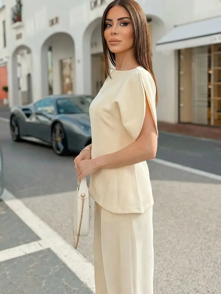 Blusa Feminina Elegante HH com Manga Bufante Sólida, Bainha Assimétrica e Gola O, Camiseta Feminina Moda Primavera 2026, Streetwear Y2K
