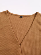 Conjunto feminino preto de tricot canelado com blusa cropped