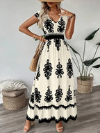 Vestido Boho Floral com Decote V e Manga Voadora